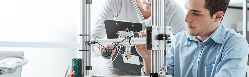 Photo of 2 people working on an experiment